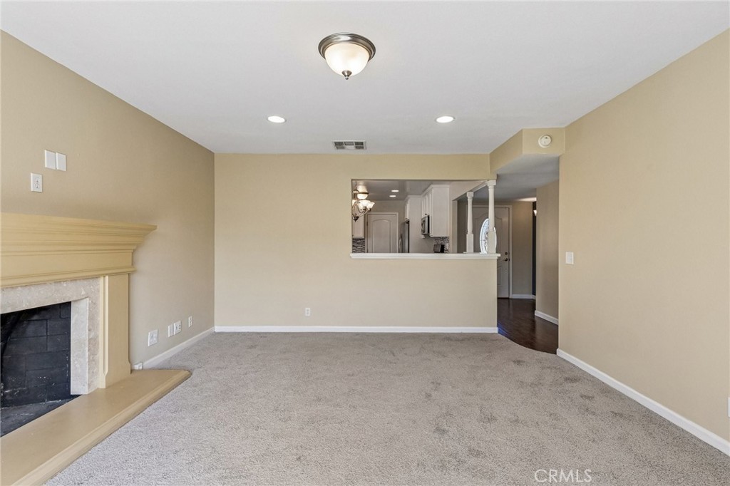 486 South Rall Avenue La Puente, CA 91746 - Photo 8 of 42 a view of a livingroom with an empty space and a fireplace