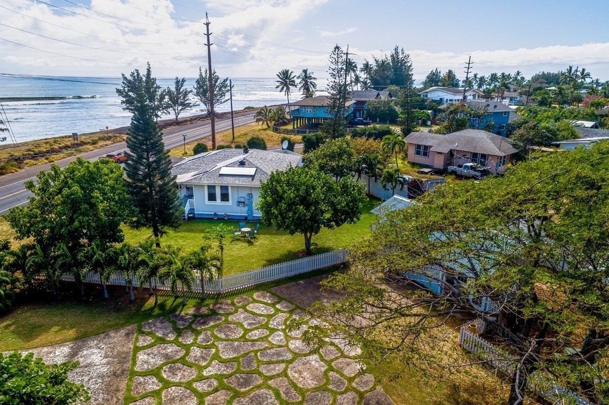 8706 Kiowea Road Kekaha, HI 96752 - Photo 1 of 30 a view of a house with a garden and lake view