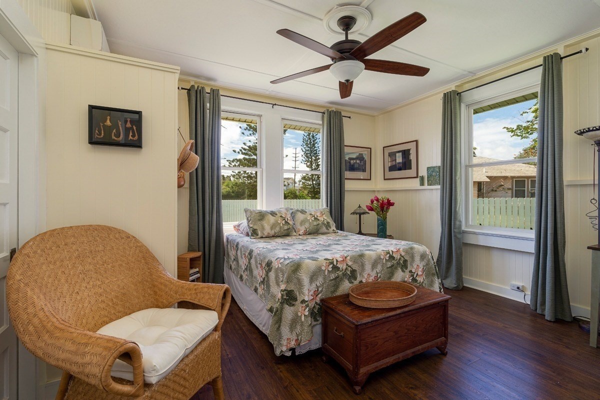 8706 Kiowea Road Kekaha, HI 96752 - Photo 14 of 30 a bedroom with a bed a window and a chandelier