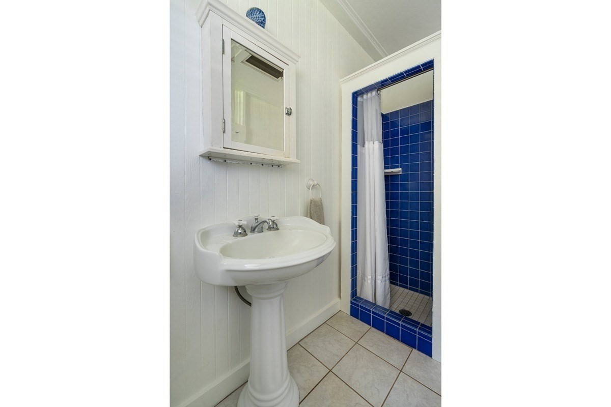 8706 Kiowea Road Kekaha, HI 96752 - Photo 16 of 30 a bathroom with a sink and a mirror