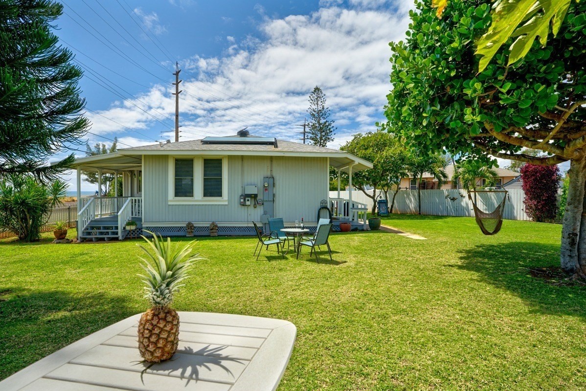 8706 Kiowea Road Kekaha, HI 96752 - Photo 19 of 30 a backyard of a house with table and chairs