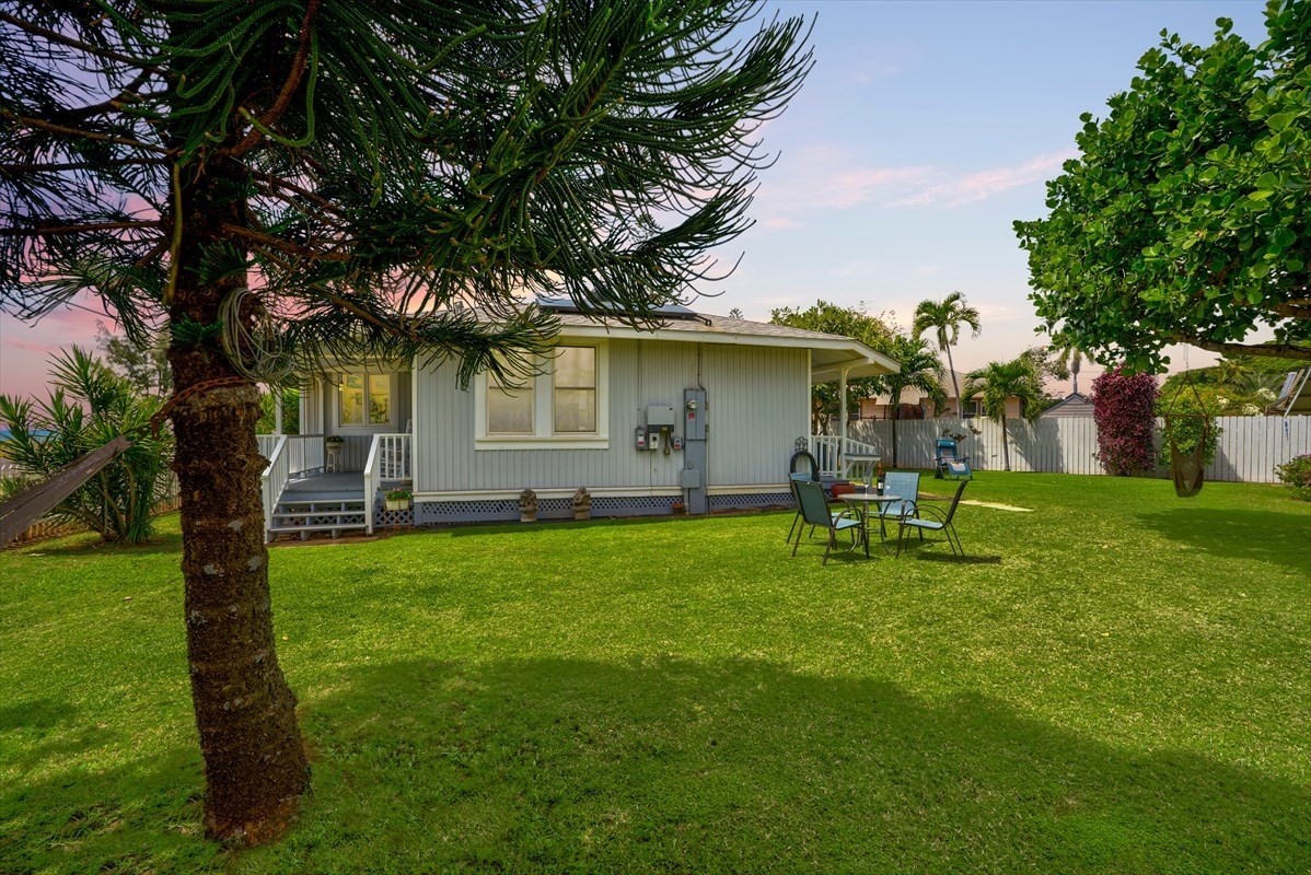 8706 Kiowea Road Kekaha, HI 96752 - Photo 20 of 30 a backyard of a house with table and chairs