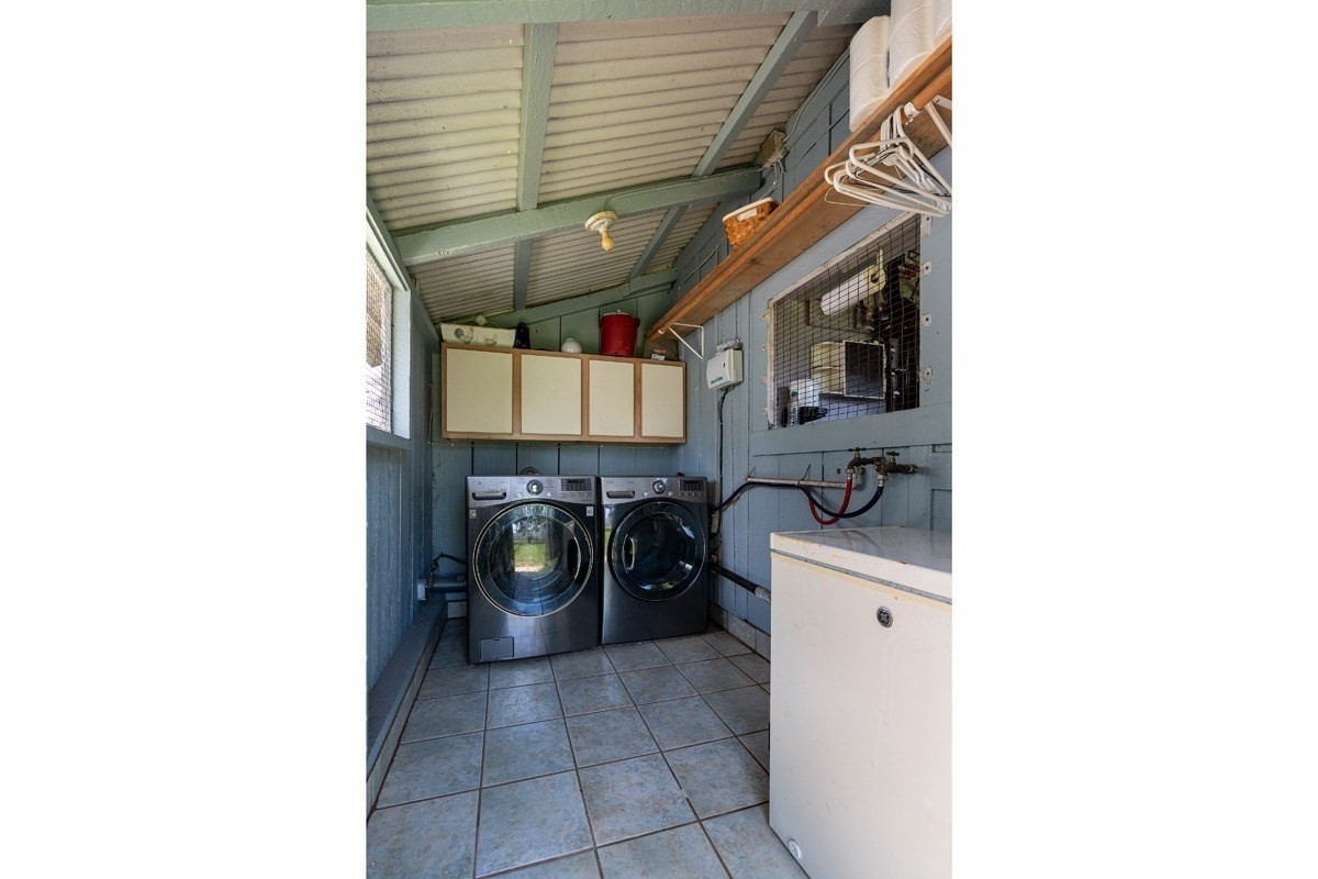 8706 Kiowea Road Kekaha, HI 96752 - Photo 22 of 30 a hallway with a white stove top oven and cabinets