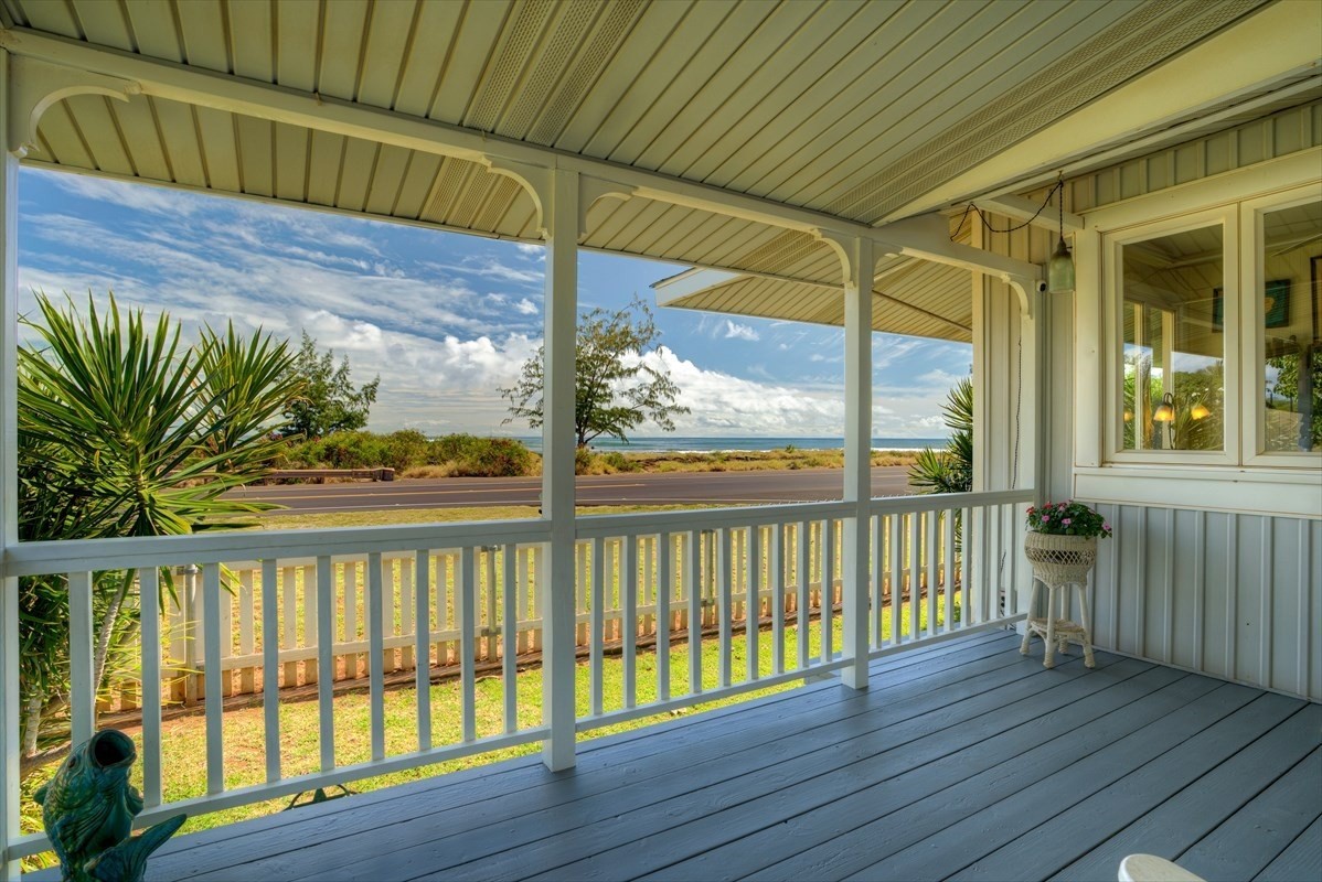 8706 Kiowea Road Kekaha, HI 96752 - Photo 3 of 30 a view of a wooden balcony with a swing