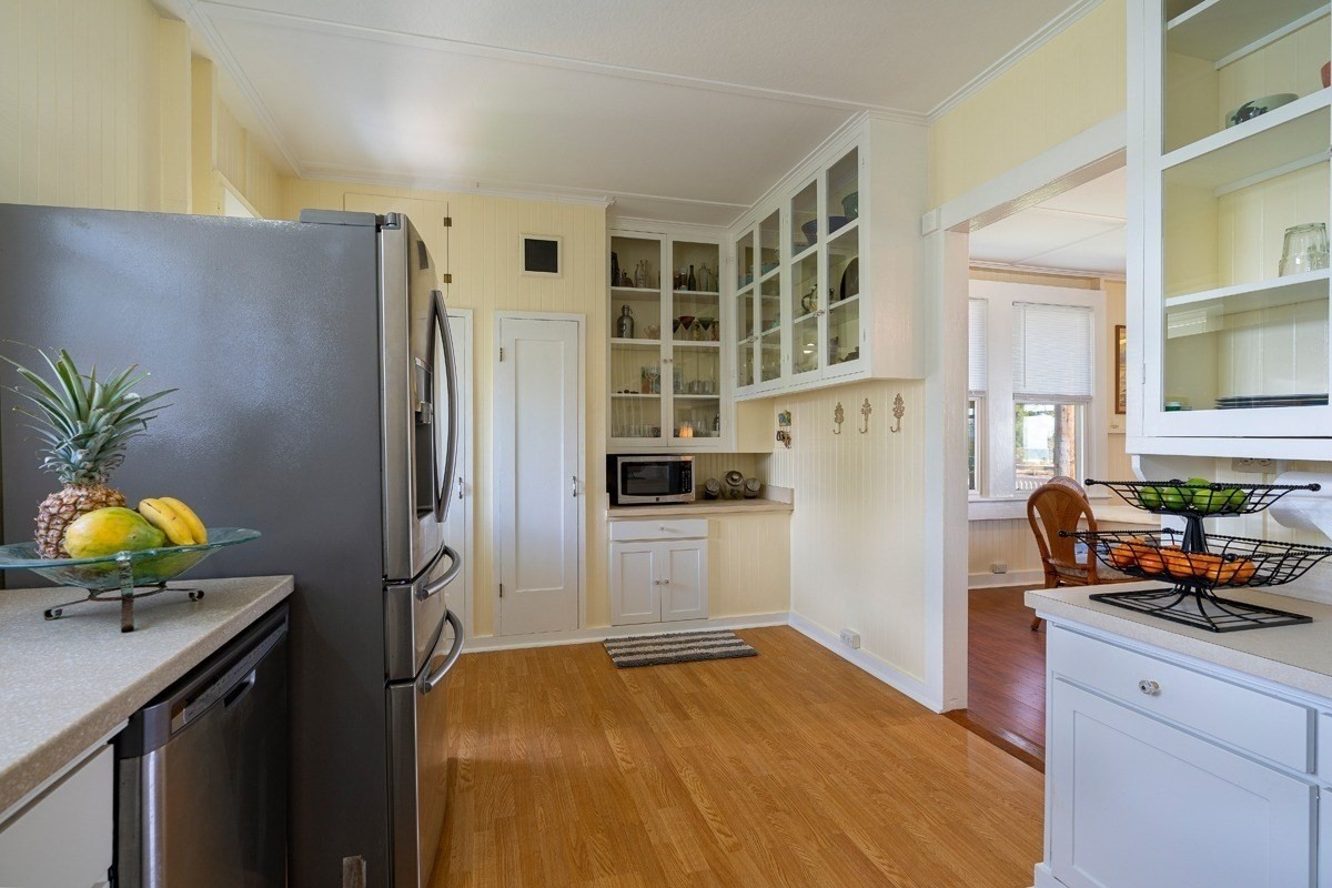 8706 Kiowea Road Kekaha, HI 96752 - Photo 6 of 30 a kitchen with stainless steel appliances a refrigerator and a sink