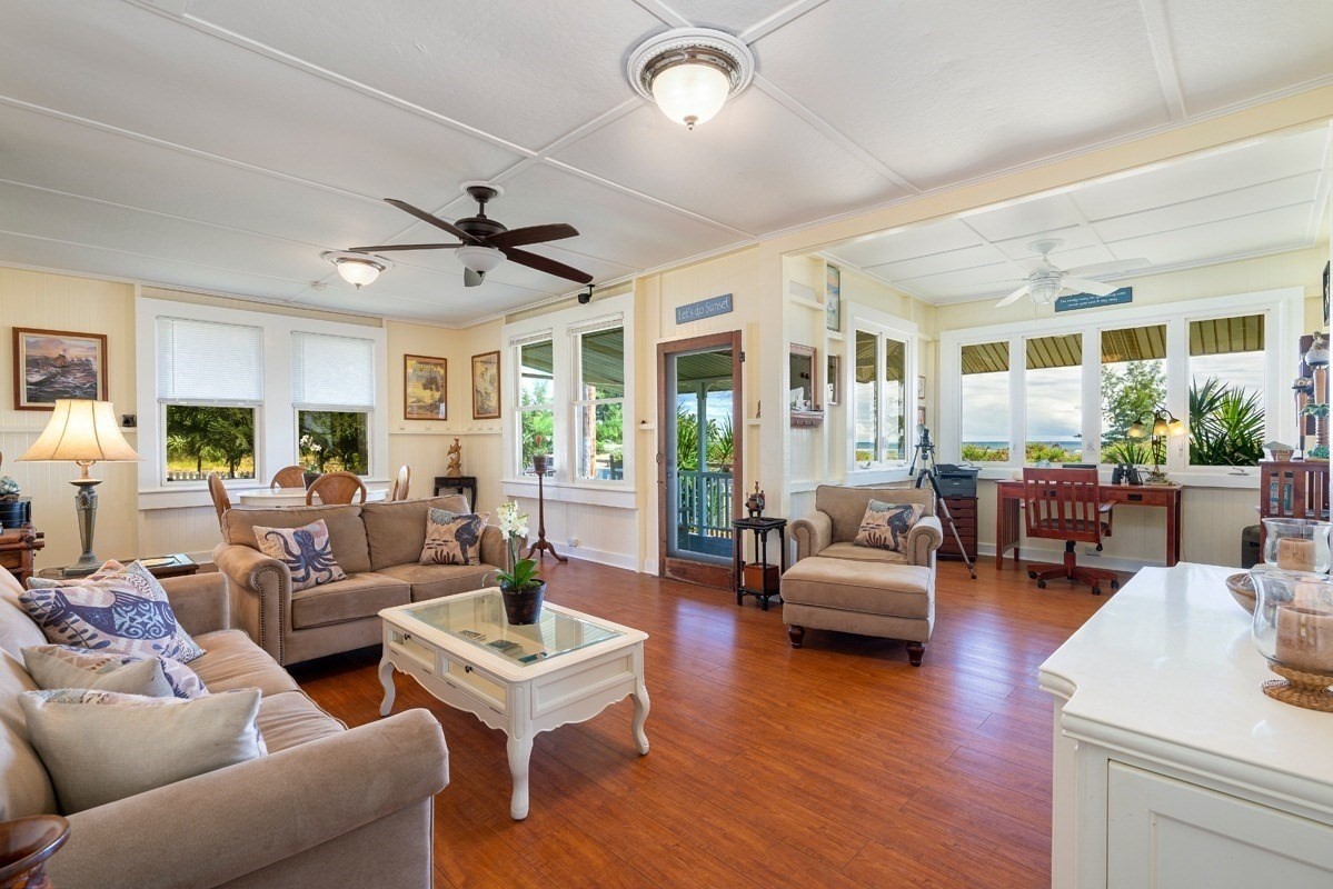 8706 Kiowea Road Kekaha, HI 96752 - Photo 8 of 30 a living room with furniture ceiling fan and a wooden floor