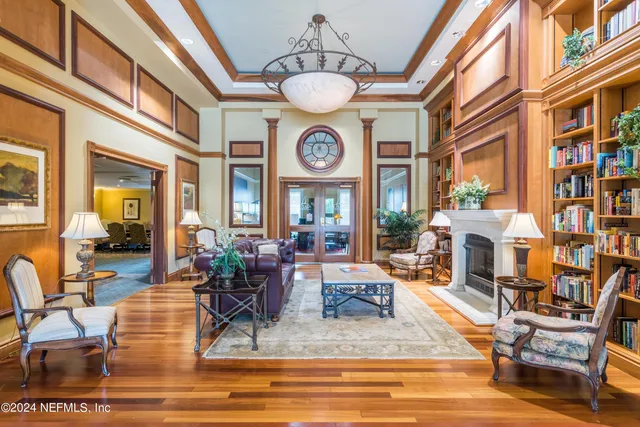 a view of a dining room with furniture wooden floor and chandelier