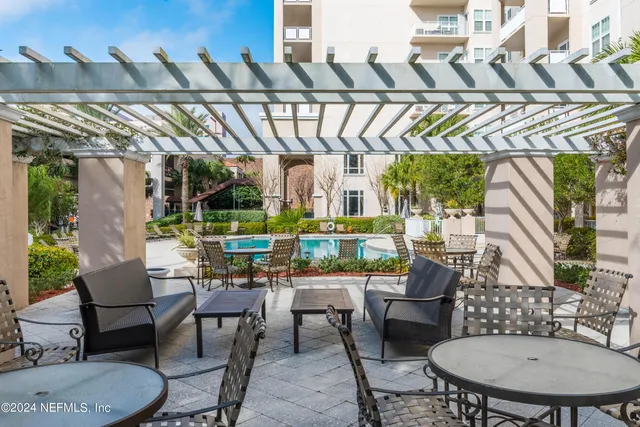 a view of a chairs and table in a patio