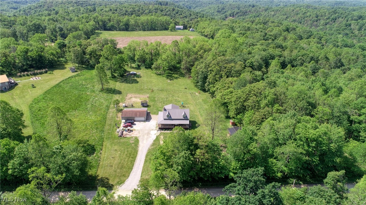 8498 Euga Road Newcomerstown, OH 43832 - Photo 36 of 49 Aerial overview of property's location with a forest
