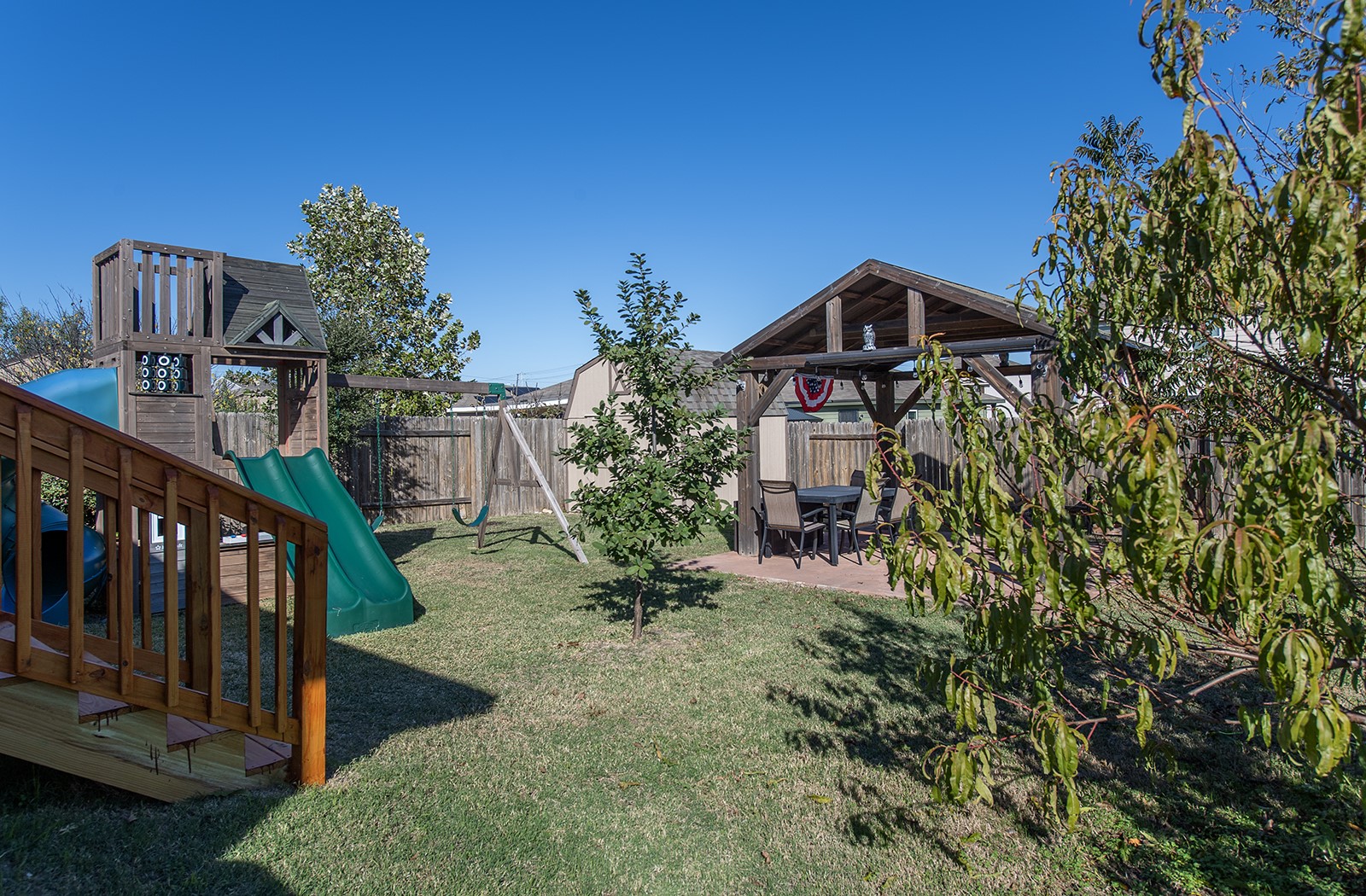 216 Millers Loop Jarrell, TX 76537 - Photo 23 of 31 Fenced backyard featuring a playground and a patio area