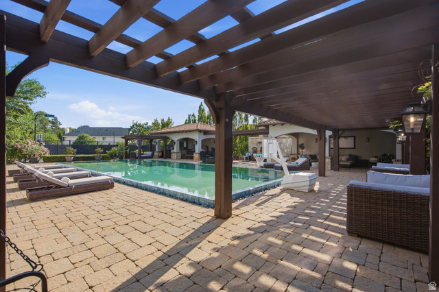 12308 Mariah Circle Draper, UT 84020 - Photo 152 of 293 Expansive outdoor living area featuring a large swimming pool, paver patio, and an extended pergola