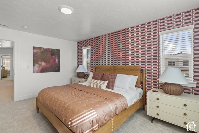 276 West 3075th Street South Logan, UT 84321 - Photo 26 of 33 Recessed ceiling lighting, patterned accent wall, single window with blinds, carpeted flooring, and a flat white ceiling