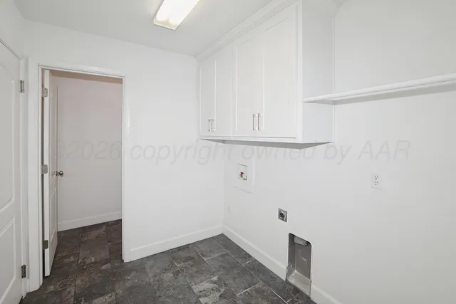 a view of storage and utility room with empty racks