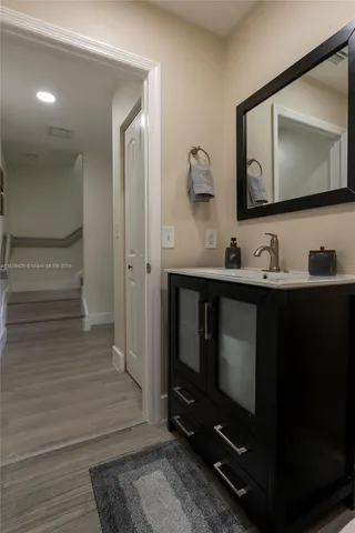 a bathroom with a double vanity sink and a mirror