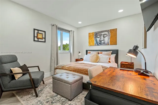 a bedroom with furniture and window