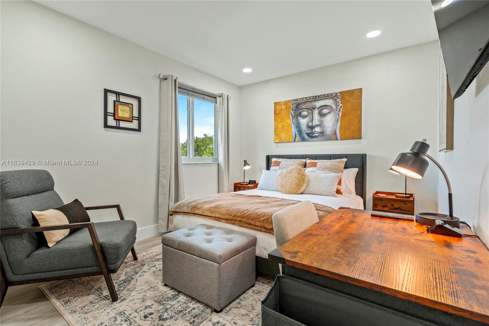 18606 Southwest 100th Avenue, Unit 18606 Cutler Bay, FL 33157 - Photo 25 of 29 a bedroom with furniture and window