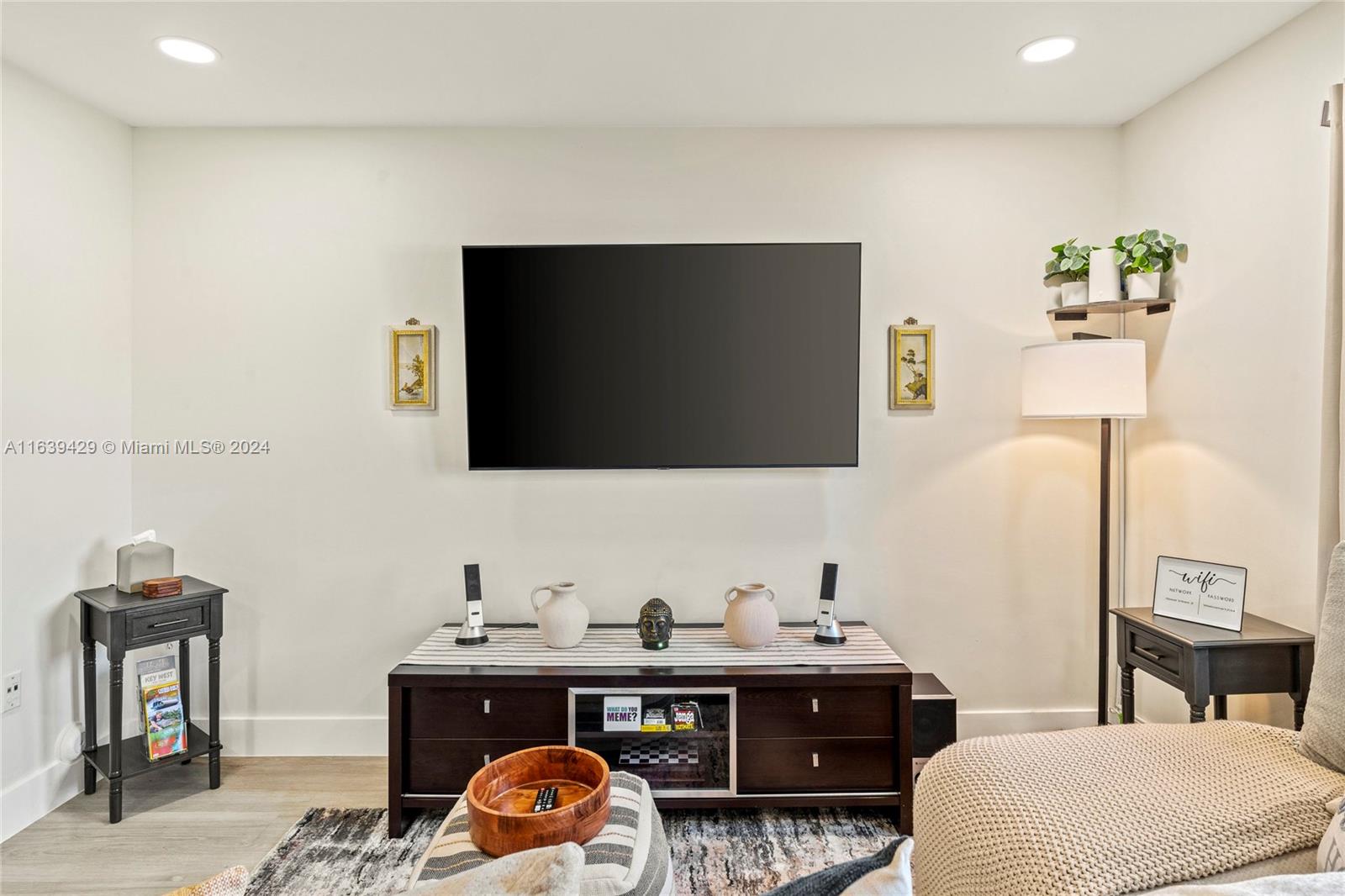 18606 Southwest 100th Avenue, Unit 18606 Cutler Bay, FL 33157 - Photo 3 of 29 a living room with furniture and a flat screen tv