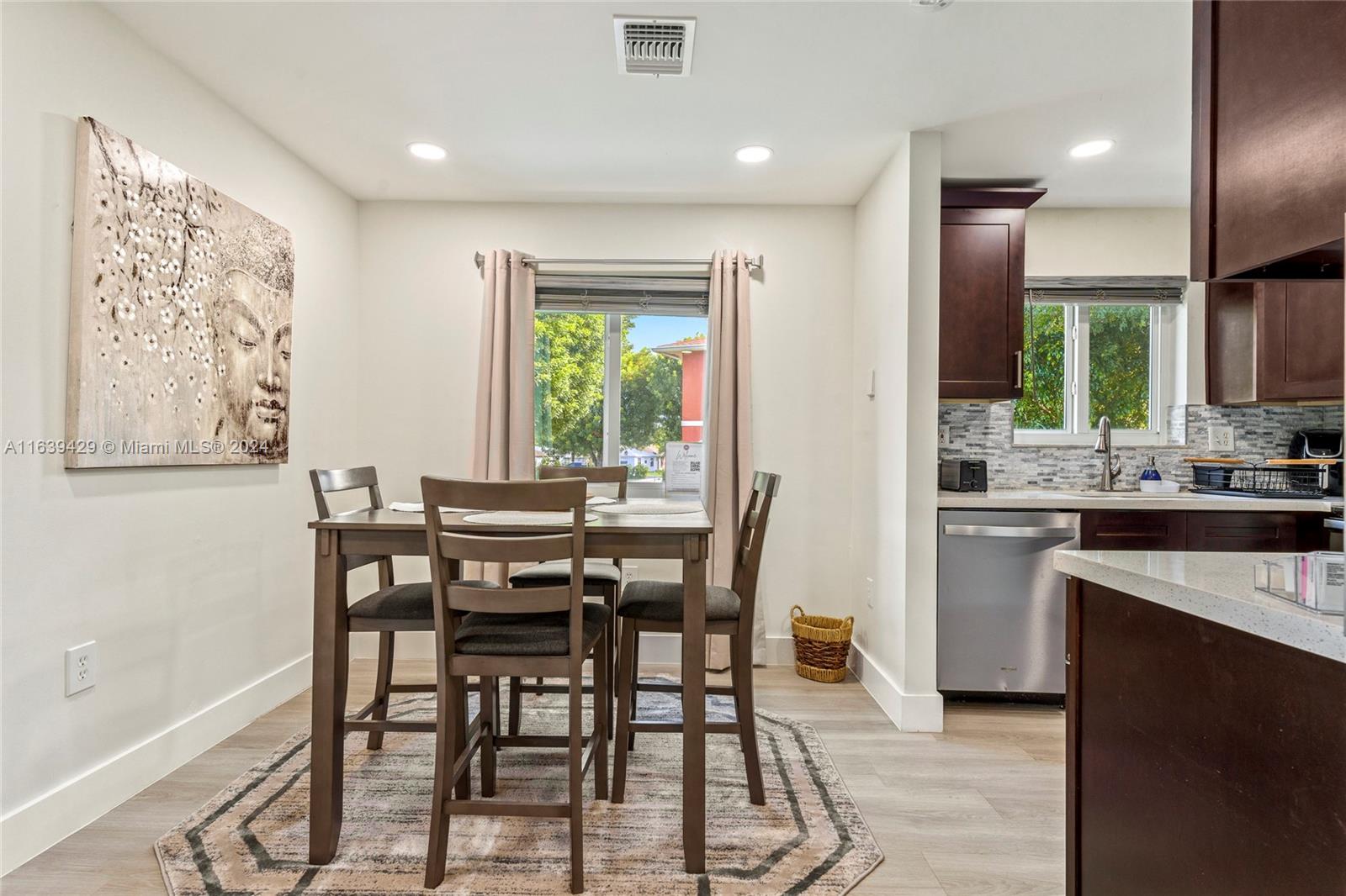 18606 Southwest 100th Avenue, Unit 18606 Cutler Bay, FL 33157 - Photo 5 of 29 a view of a dining room with furniture and a window