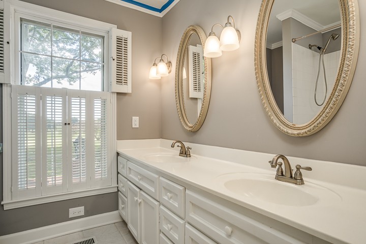 88 Lakeland Drive McMinnville, TN 37110 - Photo 31 of 41 a bathroom with a double vanity sink and a mirror