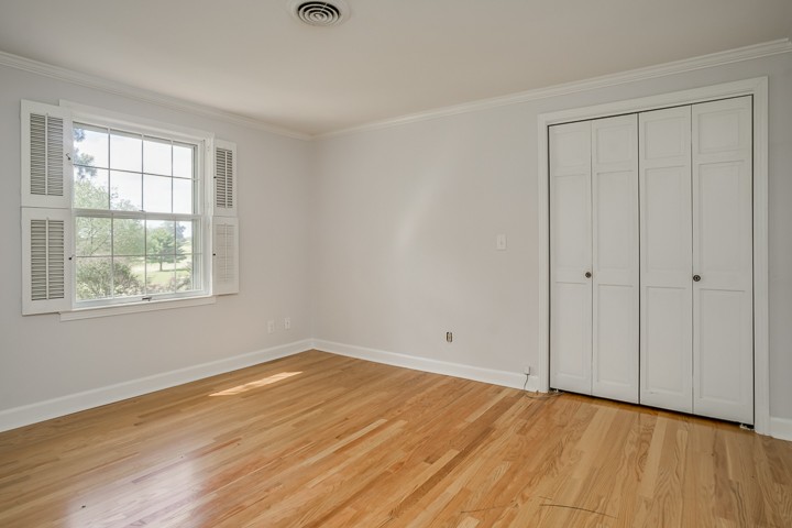 88 Lakeland Drive McMinnville, TN 37110 - Photo 33 of 41 a view of an empty room with wooden floor and a window