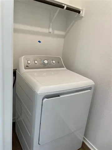 a kitchen with granite countertop a stove and a microwave