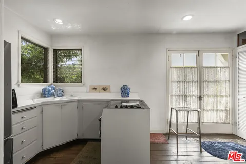 a kitchen with a refrigerator and a sink