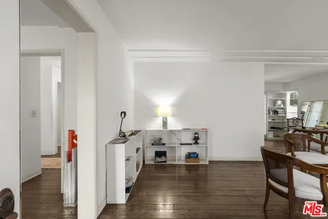a view of a workspace with wooden floor