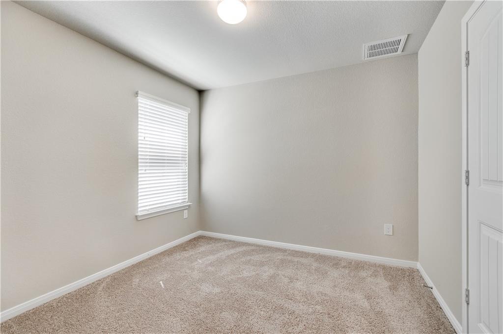 185 Voss Kyle, TX 78640 - Photo 19 of 26 an empty room with windows