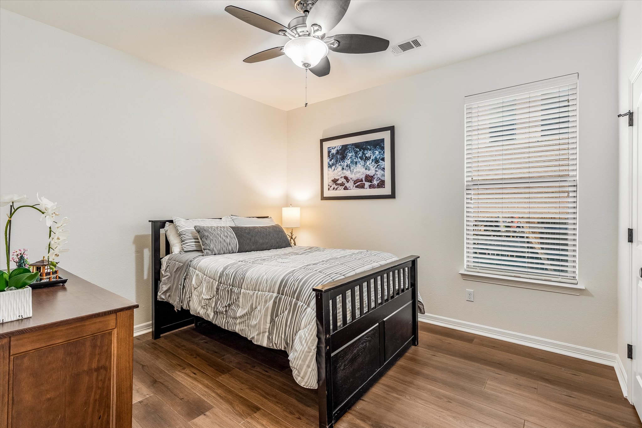 226 Galloway Lane Austin, TX 78737 - Photo 23 of 30 Bedroom featuring dark wood-style flooring and a ceiling fan