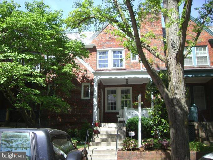 2416 39th Place Northwest Washington, DC 20007 - Photo 1 of 1 a front view of a house with garden