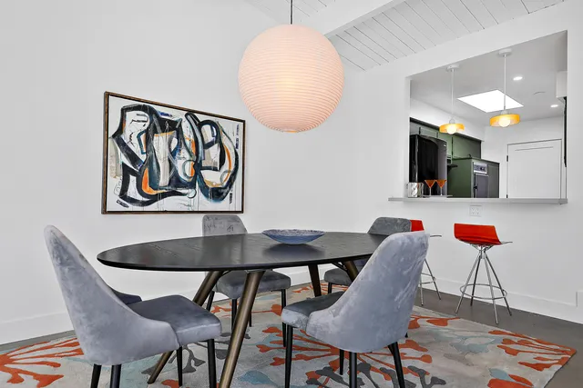 a dinning table and chairs in a room