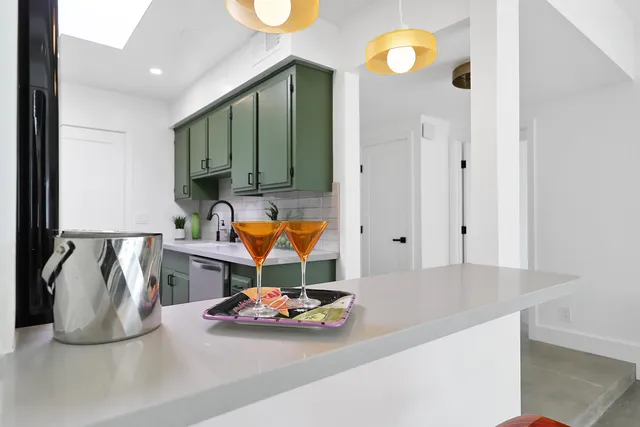 a kitchen with refrigerator and window