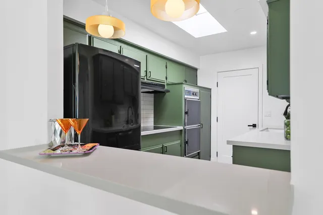 a kitchen with a sink and cabinets