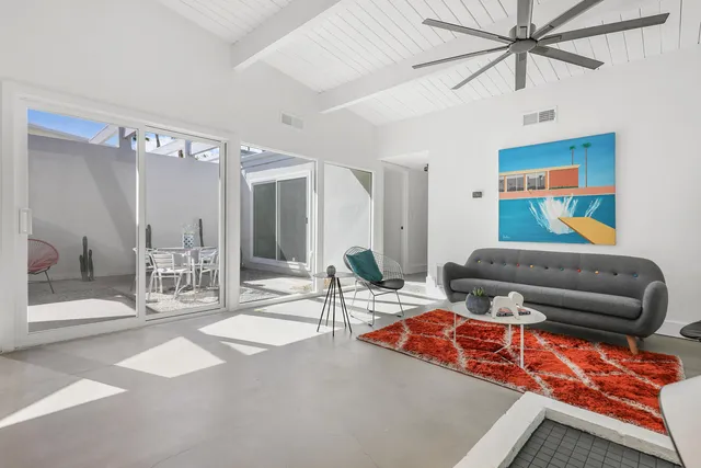 a outdoor space with lots of tables and chairs