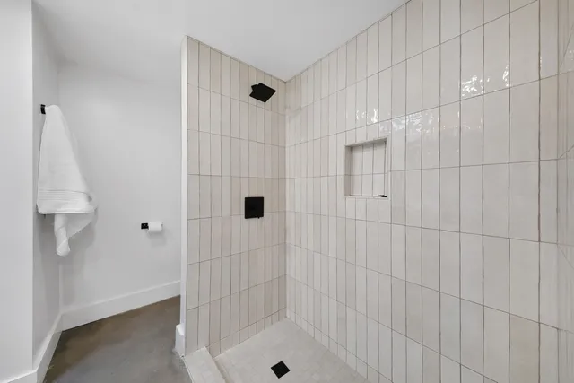 a bedroom with a bed and a potted plant