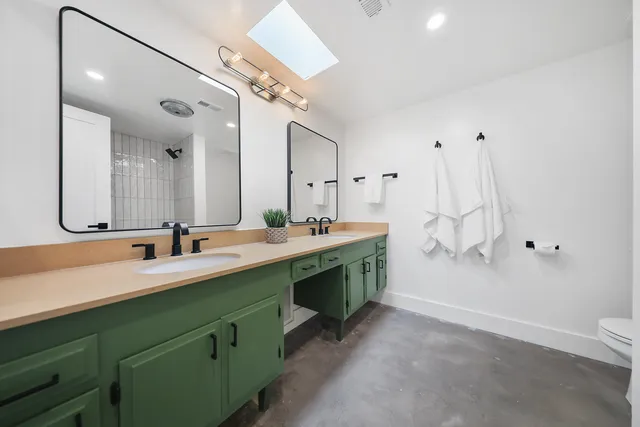 a view of a house with a big yard and potted plants