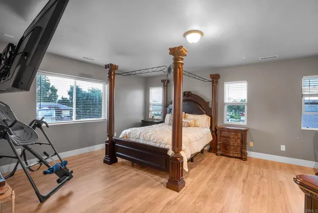 a bathroom with a sink a toilet and a window