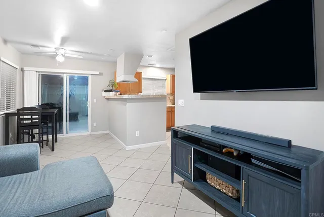 a view of a dining room with furniture and a window