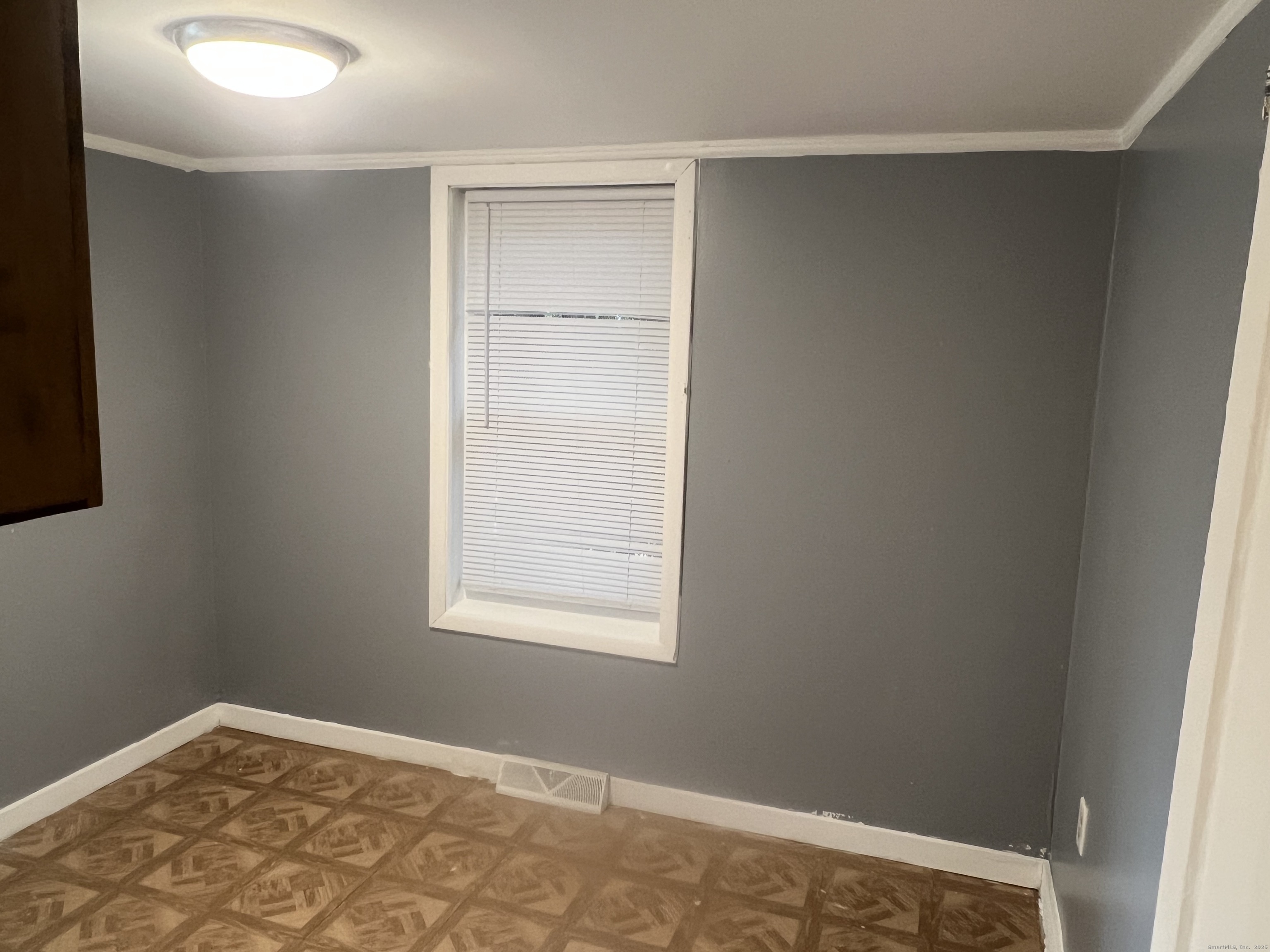 83 Litchfield Street Thomaston, CT 06787 - Photo 15 of 24 an empty room with a window