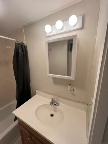 a bathroom with a sink and a mirror
