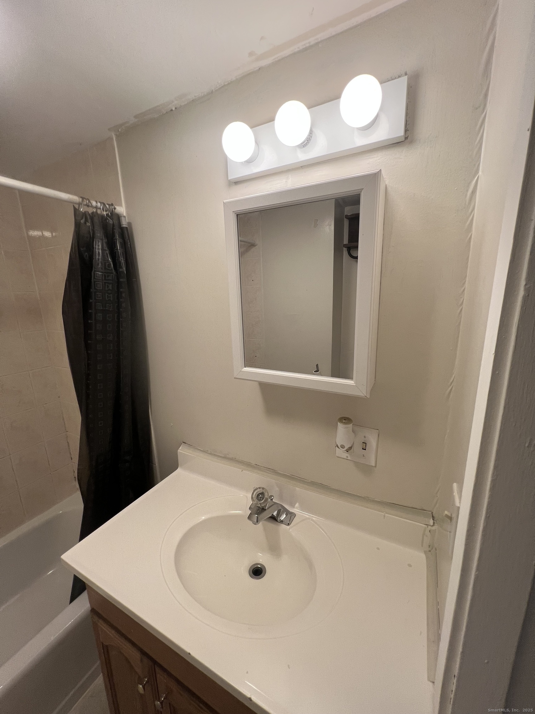 83 Litchfield Street Thomaston, CT 06787 - Photo 9 of 24 a bathroom with a sink and a mirror