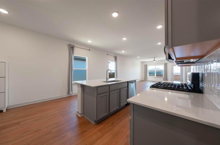 10805 Meris Lane Austin, TX 78754 - Photo 12 of 28 An open-concept living space with a contemporary kitchen island and gleaming countertops awaits.
