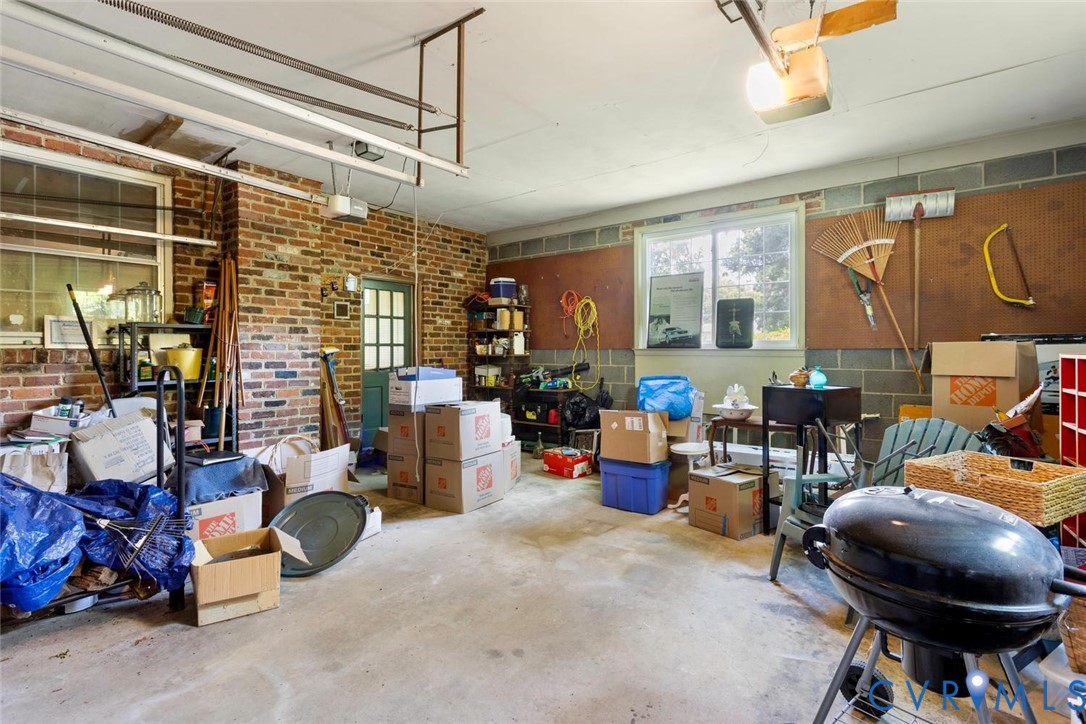 10260 Maplested Lane Henrico, VA 23229 - Photo 27 of 38 Concrete flooring garage featuring brick walls, an
