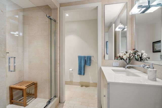 a view of building with car parked