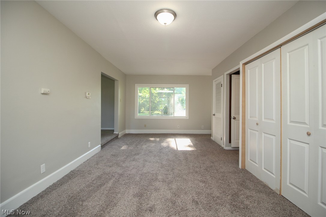 4113 Burgett Road Canfield, OH 44406 - Photo 3 of 31 Unfurnished bedroom featuring carpet flooring