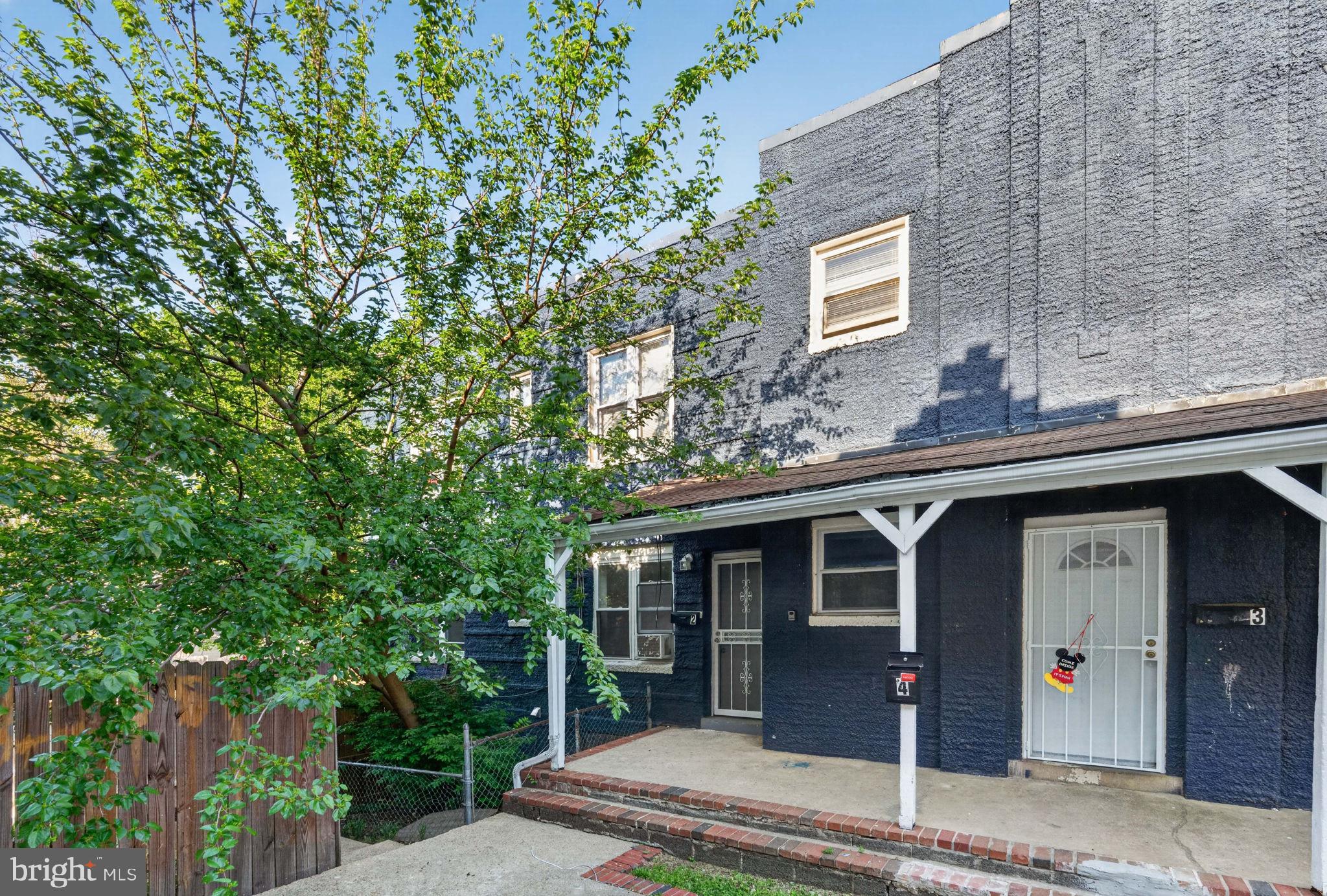 4636 Hillside Road Southeast Washington, DC 20019 - Photo 2 of 44 a front view of a house with garden