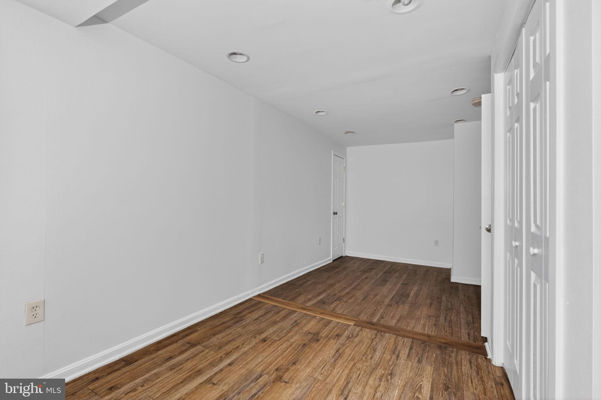 4636 Hillside Road Southeast Washington, DC 20019 - Photo 25 of 44 a view of a room with wooden floor