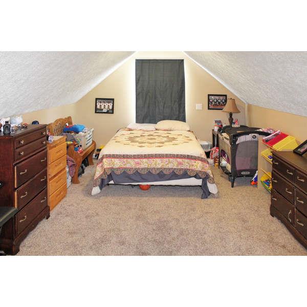 398 Strawberry Ridge Manchester, TN 37355 - Photo 23 of 30 a bedroom with a bed and a dresser