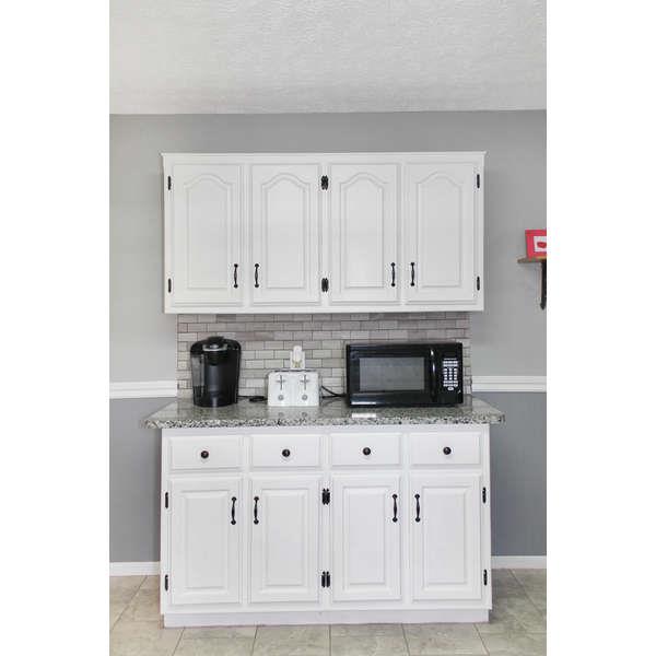 398 Strawberry Ridge Manchester, TN 37355 - Photo 26 of 30 a kitchen with stainless steel appliances white cabinets and a sink