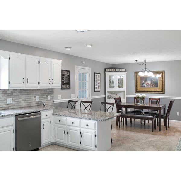 398 Strawberry Ridge Manchester, TN 37355 - Photo 6 of 30 a living room with furniture a dining table and kitchen view